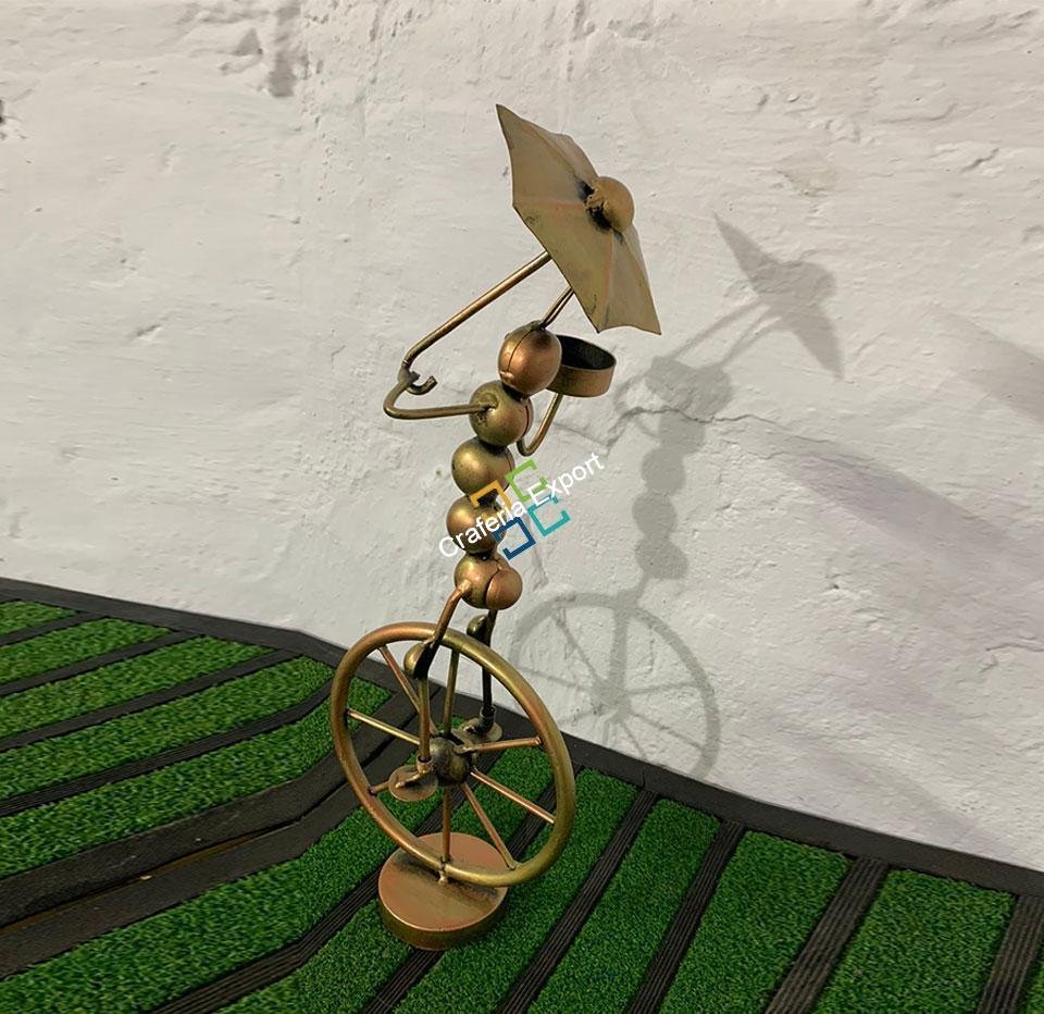 metal tribal lady with umbrella tea light candle holder