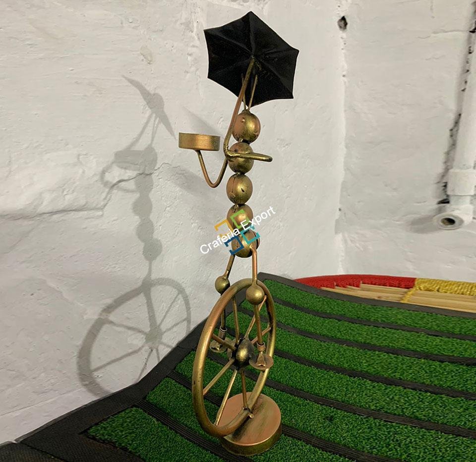 metal tribal lady with umbrella tea light candle holder